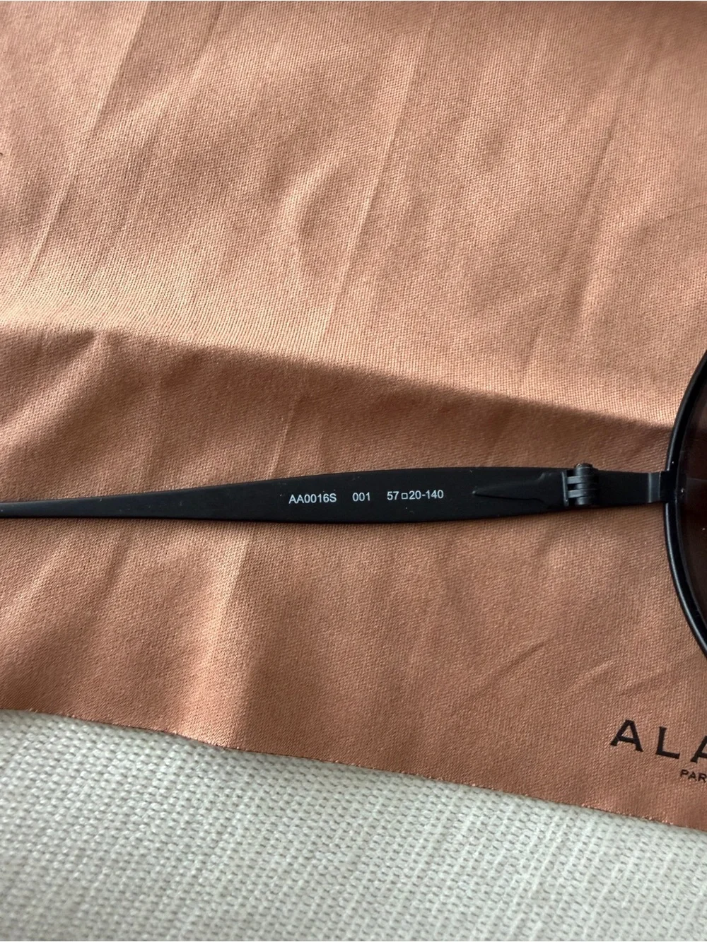 ALAÏA AA0016S 001 Oval Black Metal Sunglasses 57-20-140 + Case & Cloth